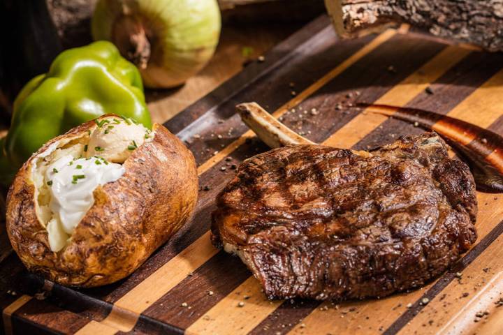 A tomahawk ribeye from West Texas Chophouse, an El Paso, Texas, steakhouse that debuted in fall ...