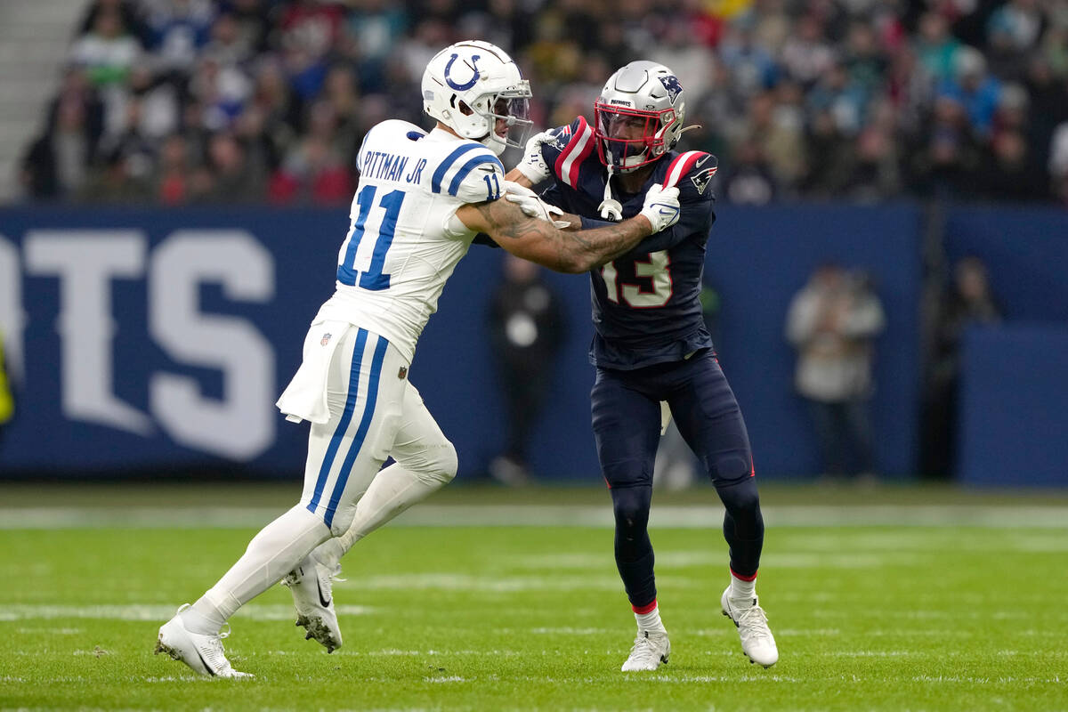 New England Patriots cornerback Jack Jones (13) battles against Indianapolis Colts wide receive ...