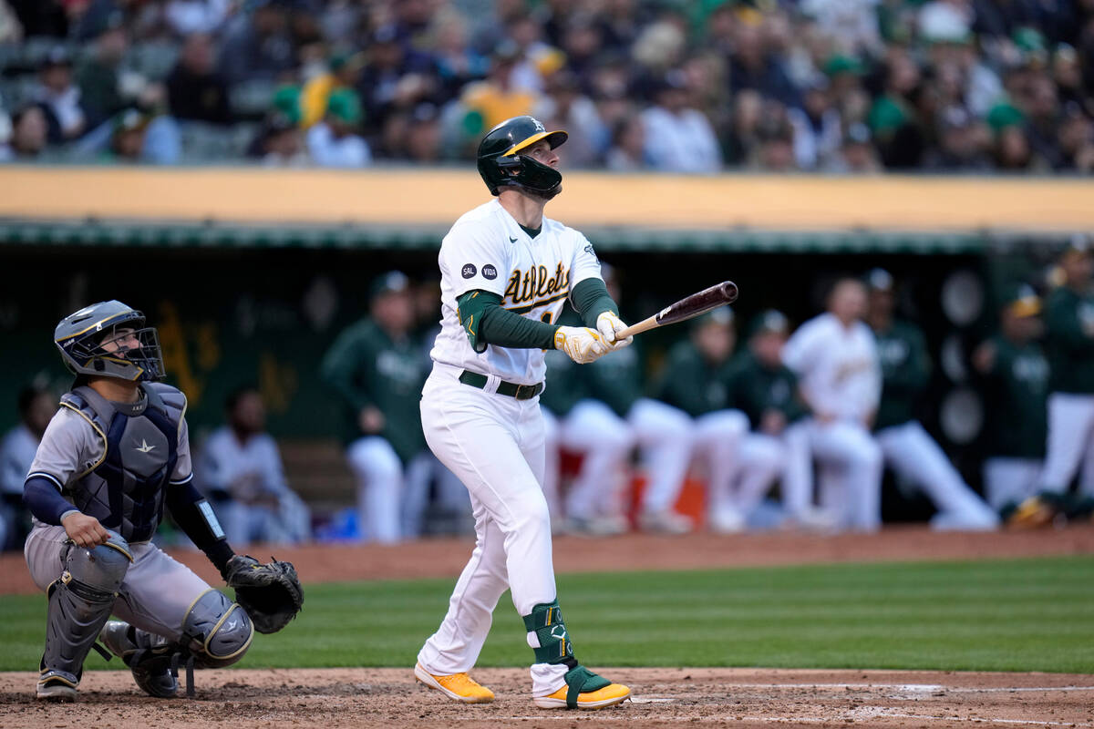 Oakland Athletics' Seth Brown watches his solo home run against the New York Yankees during the ...