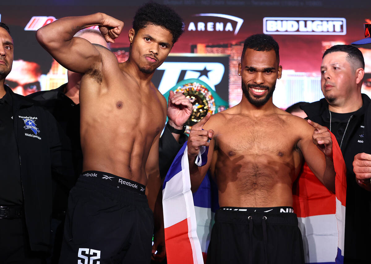 Shakur Stevenson (left) poses alongside Edwin De Los Santos (right) after weighing in for their ...