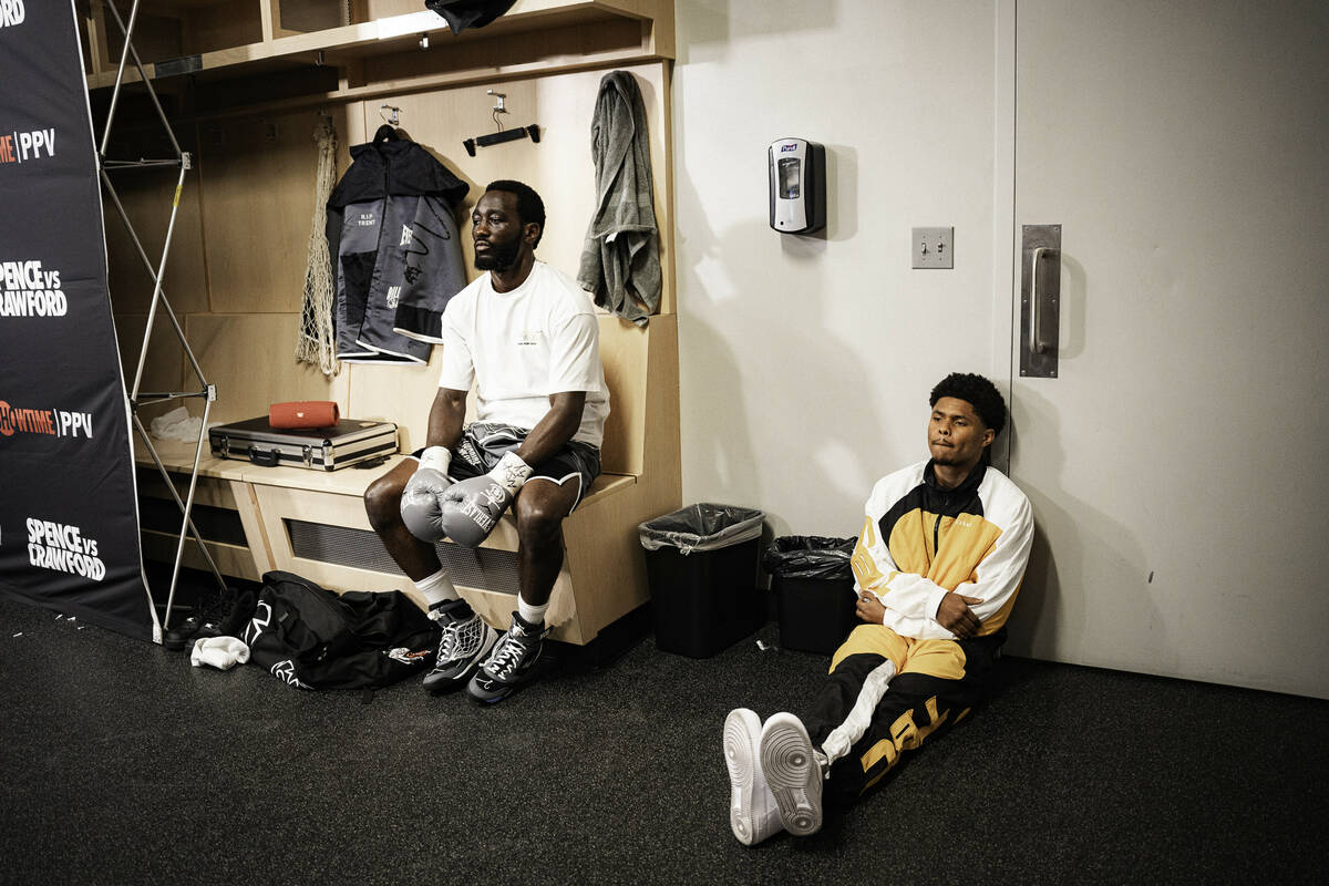 Shakur Stevenson (right) sits with Terence Crawford (left) inside the T-Mobile Arena dressing r ...