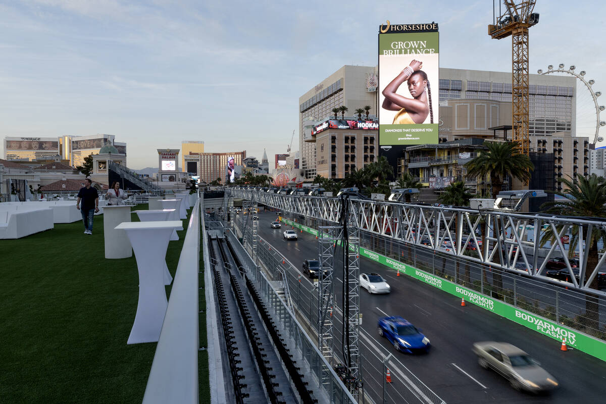 Traffic moves on Las Vegas Boulevard as seen from the grandstands at the Bellagio Fountain Club ...