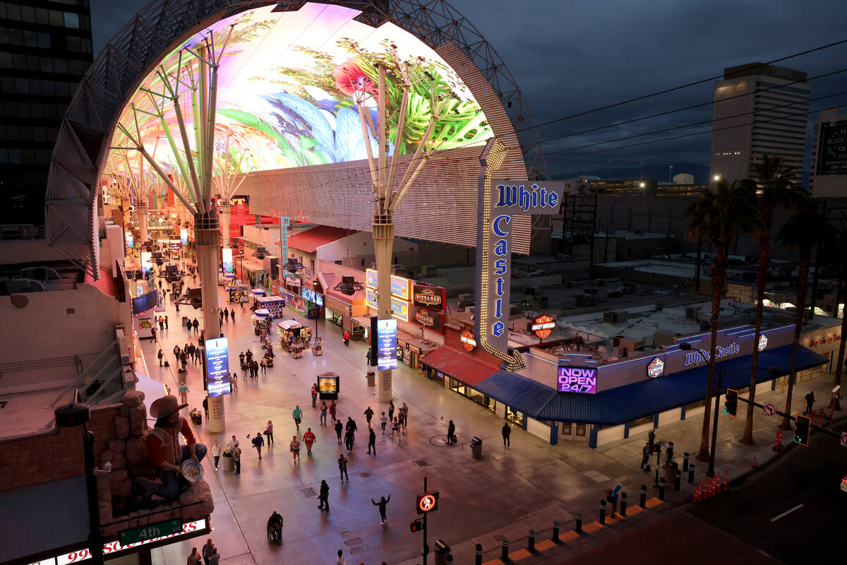 People walk through the Fremont Street Experience in downtown Las Vegas on Wednesday, Nov. 15, ...