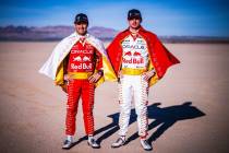 Oracle Red Bull Racing drivers Max Verstappen and Sergio Perez in "Viva Las Vegas" race suits i ...