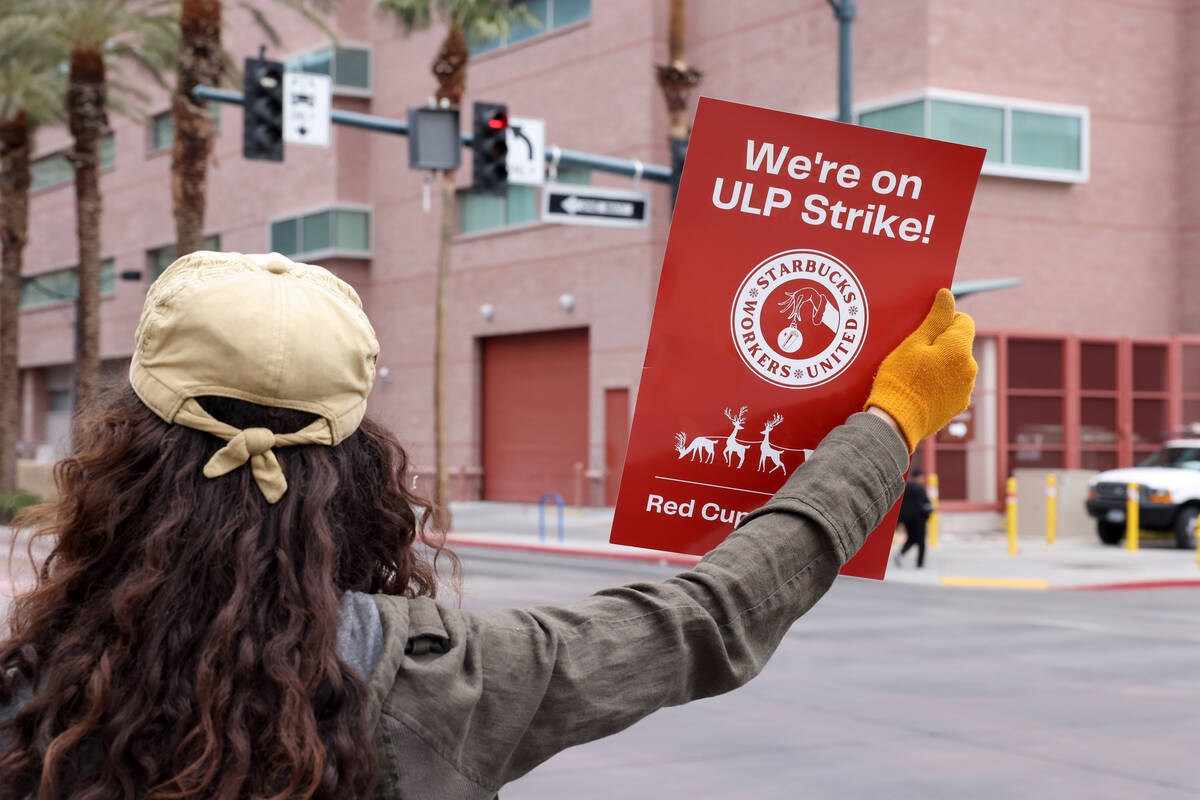 Starbucks barista Andrew Williams pickets at the Casino Center Boulevard and Clark Avenue store ...