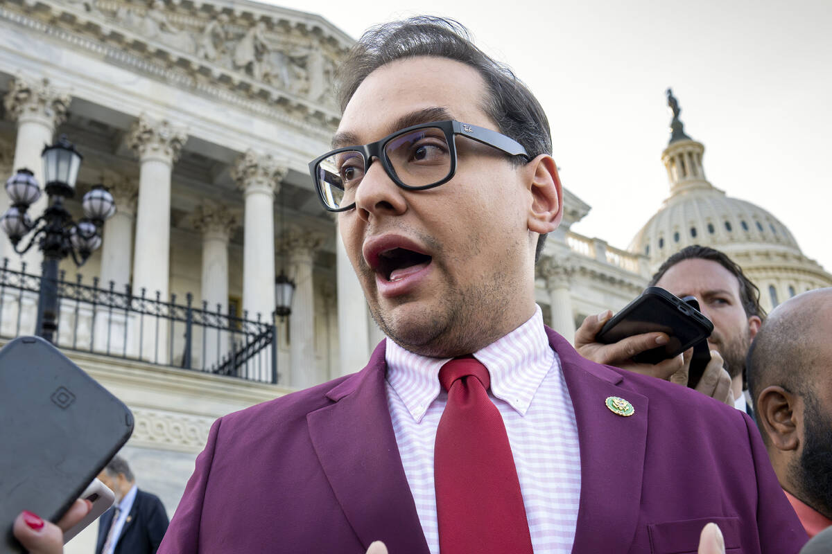FILE - Rep. George Santos, R-N.Y., speaks to reporters outside the Capitol, in Washington, May ...