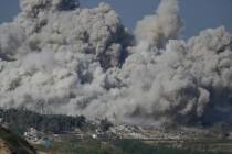 Smoke rises after an Israeli strike on the Gaza Strip on Thursday, Nov. 16, 2023. (AP Photo/Leo ...