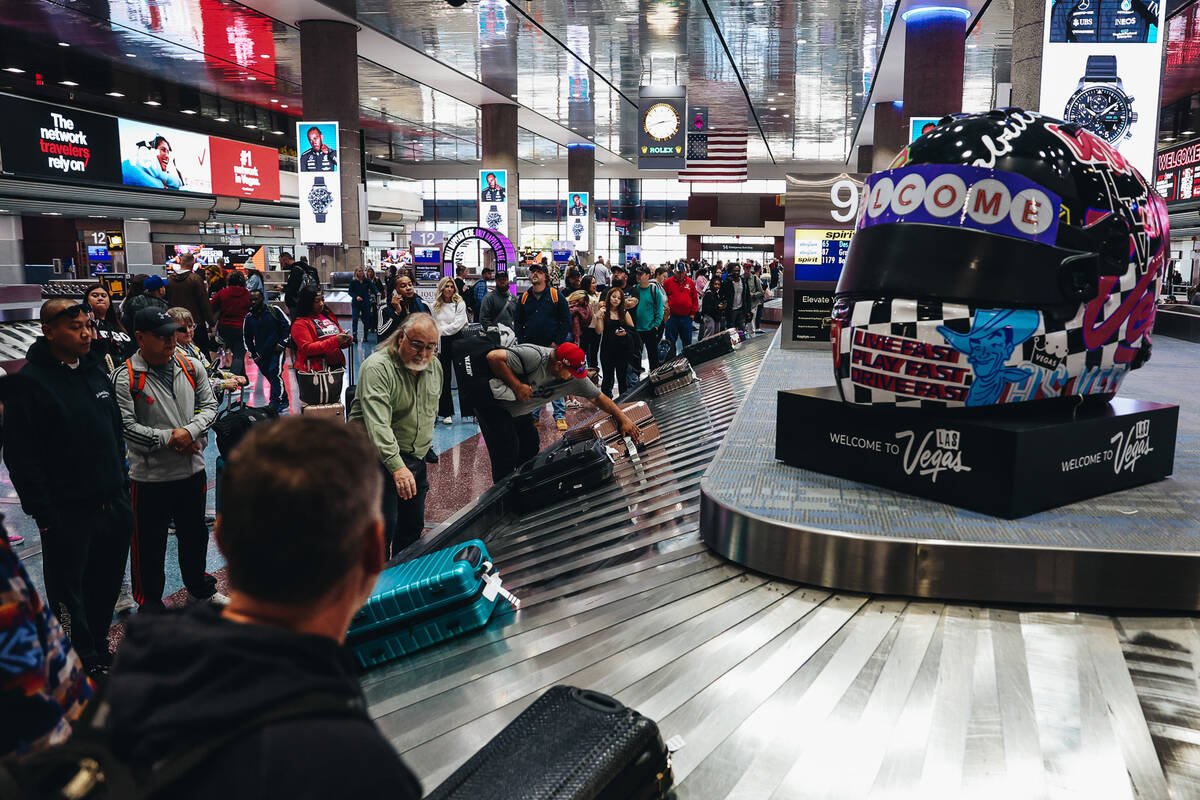 People want for their baggage after flying into Las Vegas at Harry Reid International Airport o ...