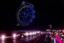 Drones form a flying timepiece as Mercedes-AMG drivers Lewis Hamilton and George Russell cruise ...