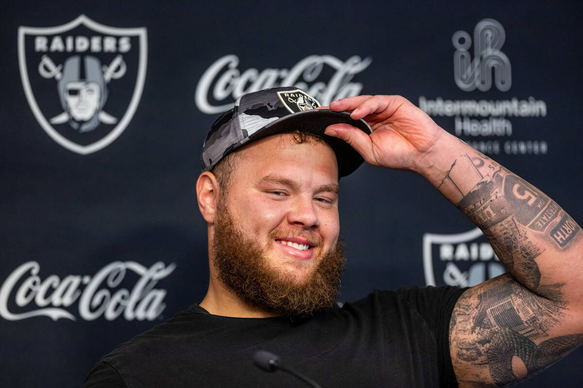 Raiders center Andre James (68) listens to a question during a press conference in training cam ...