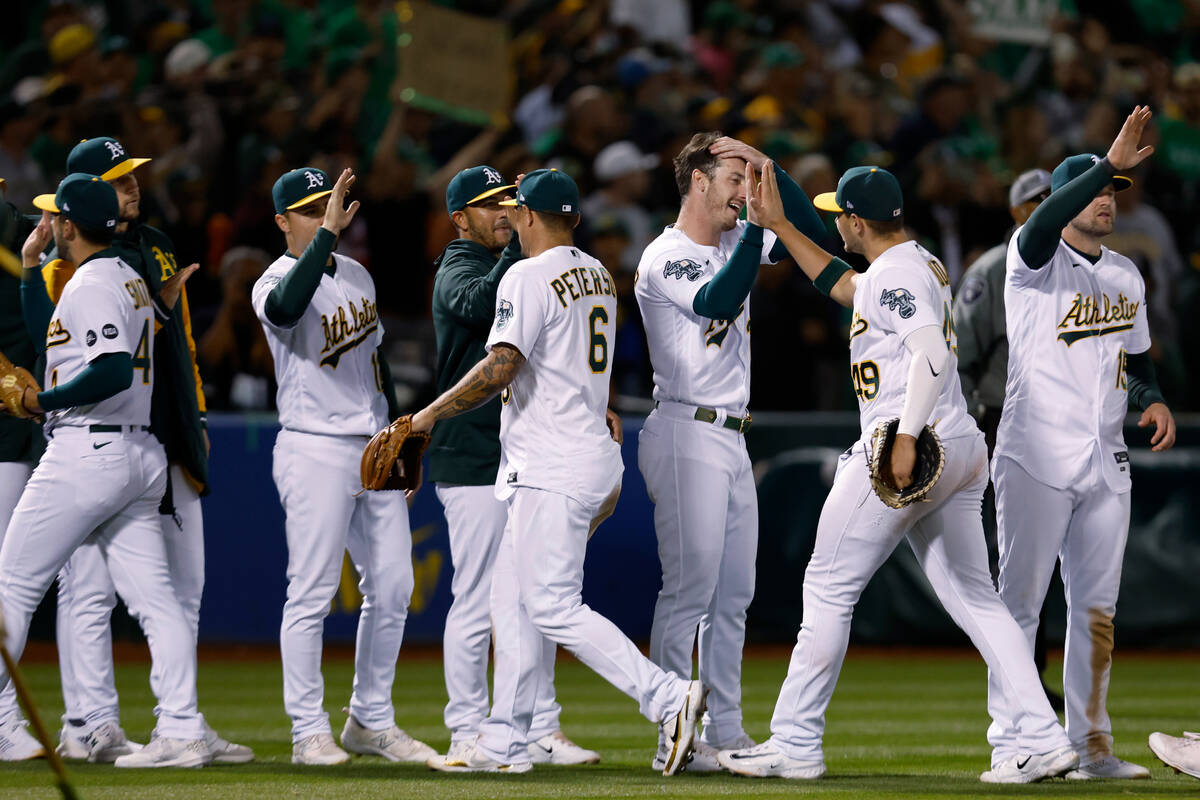 The Oakland Athletics celebrate after defeating the Tampa Bay Rays in a baseball game in Oaklan ...