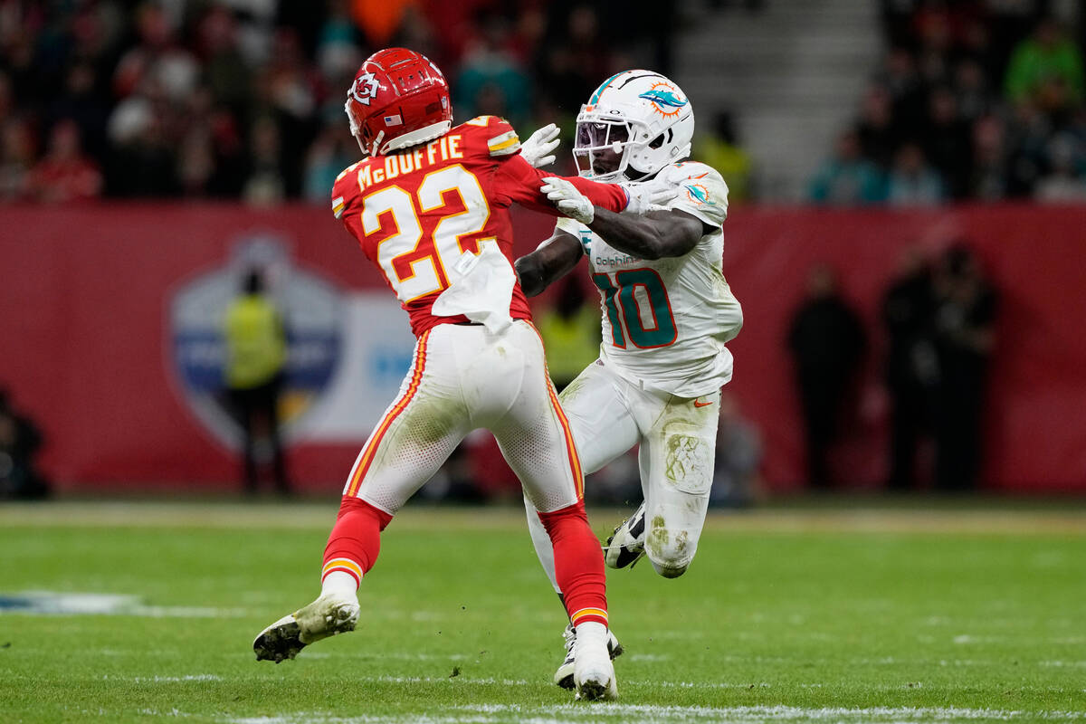Miami Dolphins wide receiver Tyreek Hill (10) looks to get past Kansas City Chiefs cornerback T ...