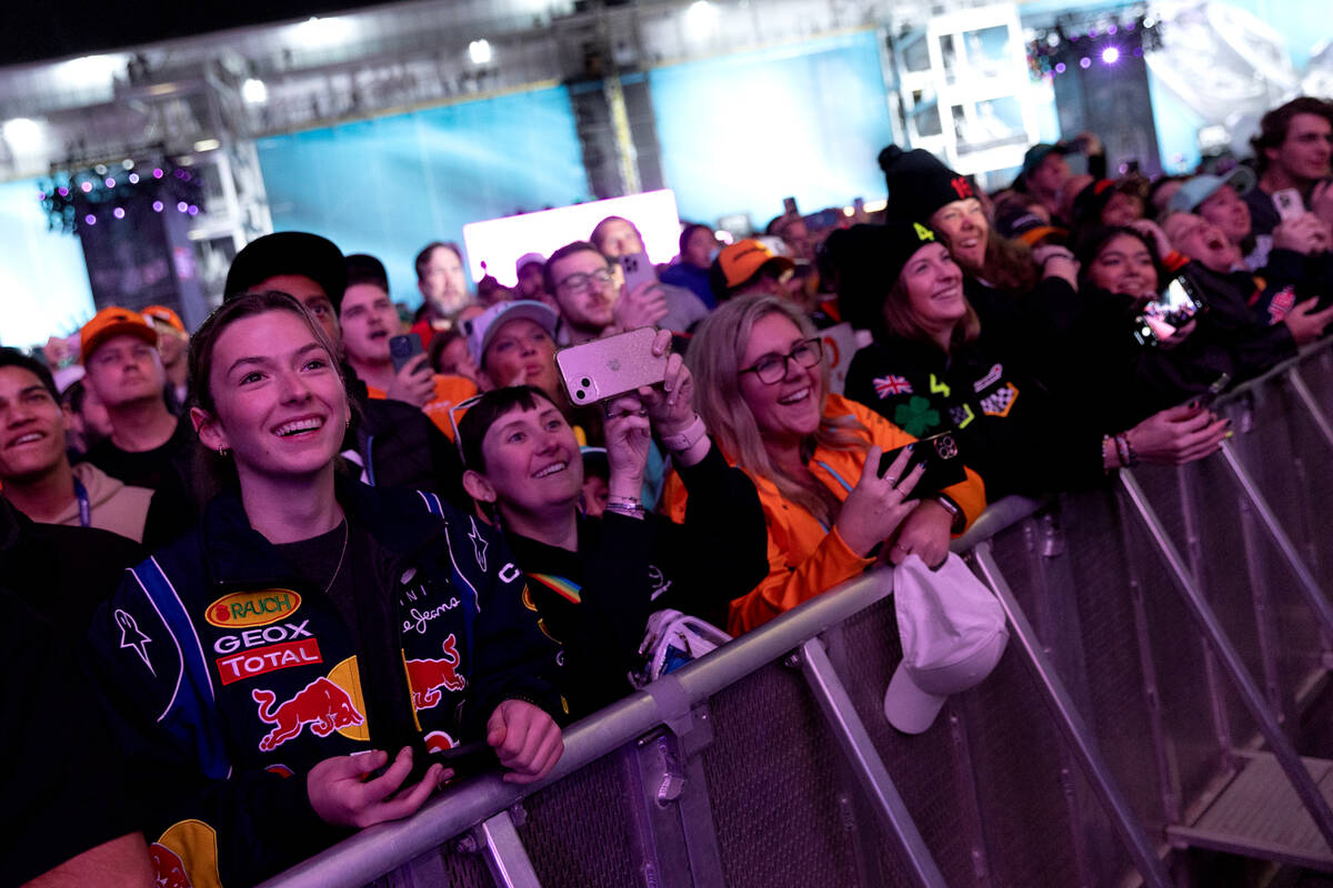 Fans admire Formula One drivers on stage before the first practice run of the Las Vegas Grand P ...