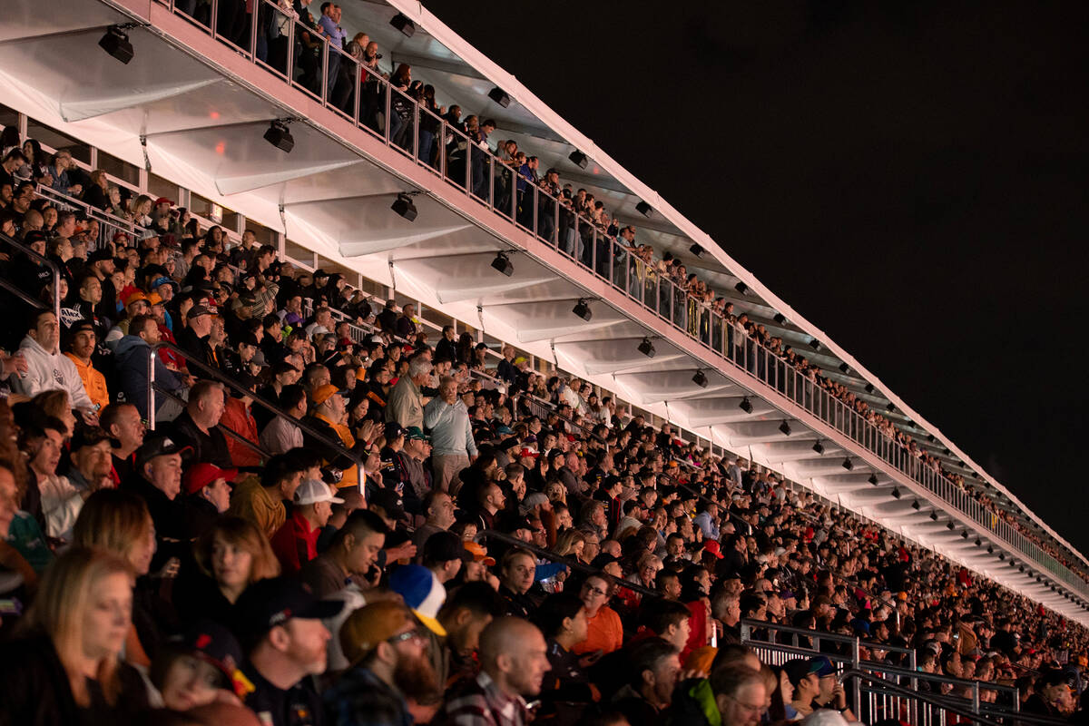 Fans view the first practice of the Formula One Las Vegas Grand Prix auto race from the grandst ...