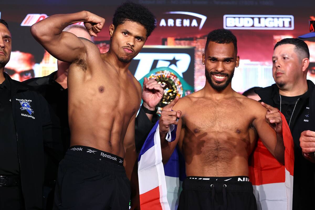 Shakur Stevenson (left) poses alongside Edwin De Los Santos (right) after weighing in for their ...