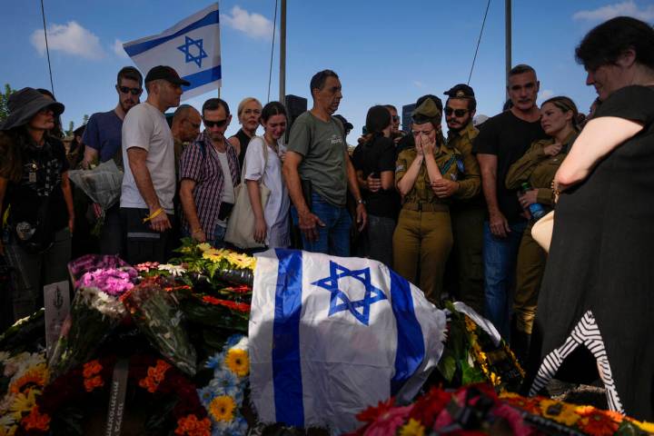 Mourners attend the funeral of Israeli soldier, Noa Marciano, in Modiin, Israel, Friday, Nov. 1 ...