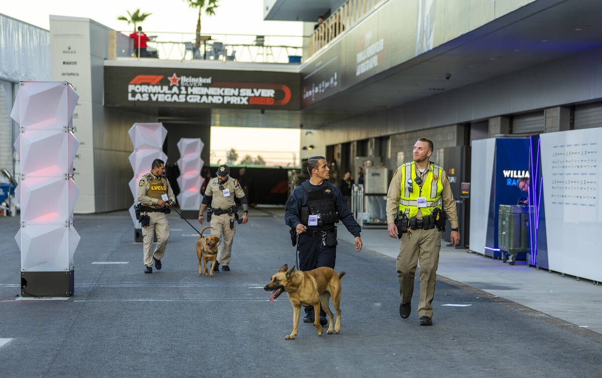 A police security detail walks about the pit building during the second night of the Las Vegas ...