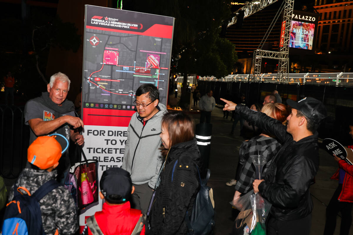 Strip tourists are provided directions around the Formula 1 racetrack prior to the third practi ...