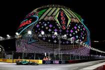 Aston Martin driver Fernando Alonso turns the corner at the MSG Sphere during Friday, Nov. 17, ...