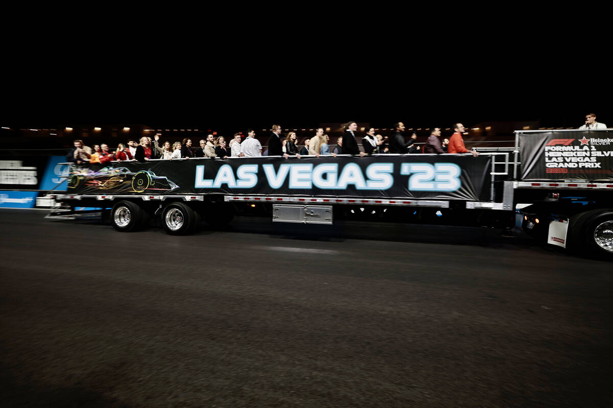 Fans get a tour of the Las Vegas Formula 1 track on a flatbed truck before practice on Friday, ...