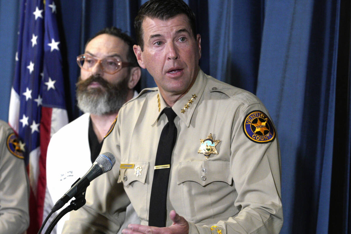 Ventura County Sheriff Jim Fryhoff takes questions as Chief Medical examiner Ventura, Dr. Chris ...