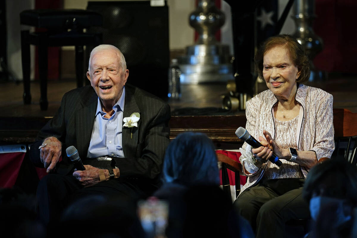 FILE - Former President Jimmy Carter and his wife former first lady Rosalynn Carter sit togethe ...