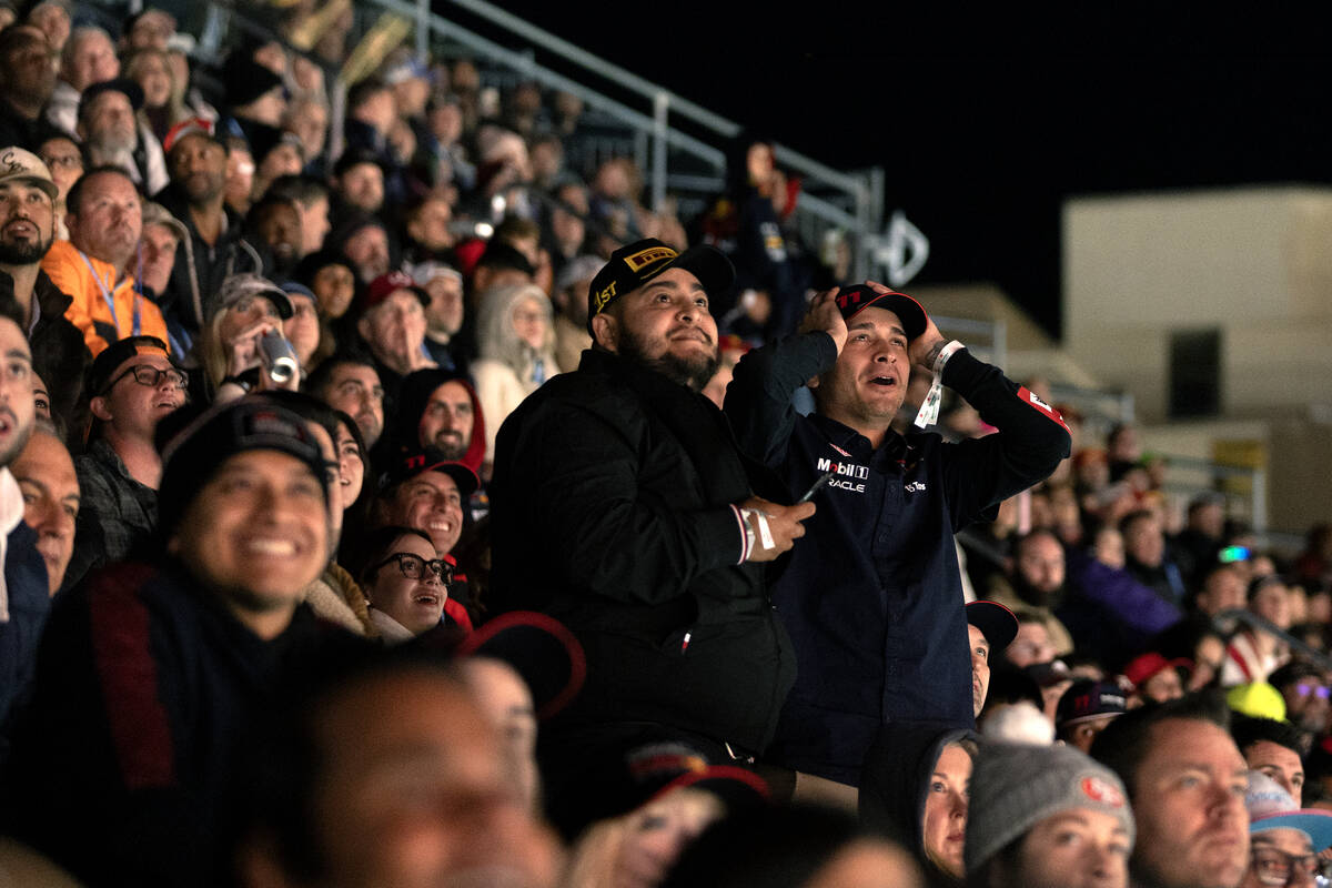 Fans react during the final laps of the Formula One Las Vegas Grand Prix auto race on Sunday, N ...