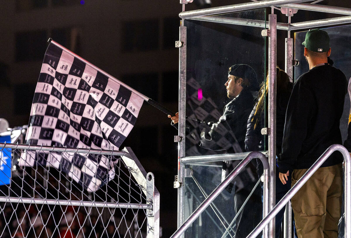 Justin Bieber waves the checkered flag at the end of the race during the Las Vegas Grand Prix F ...