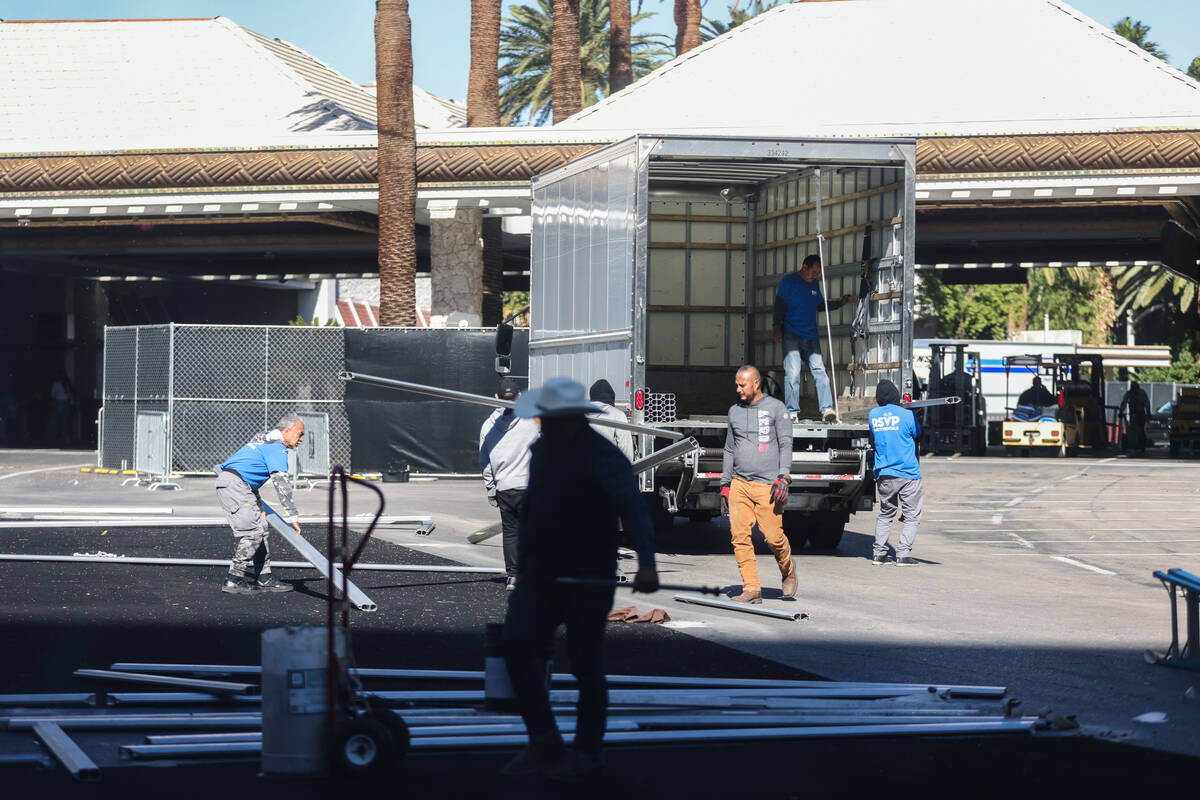 Workers disassemble a pop-up area that was for entertaining guests of the Formula 1 Las Vegas G ...