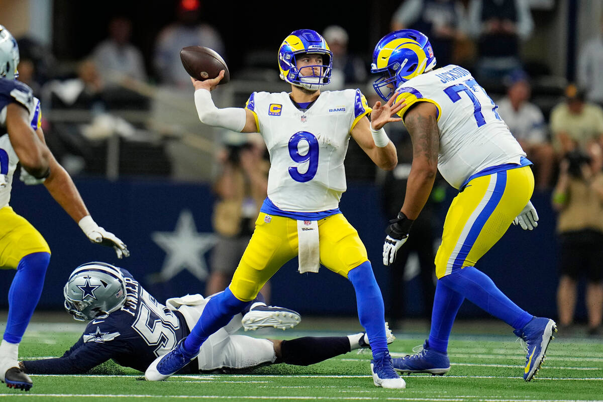 Los Angeles Rams quarterback Matthew Stafford (9) throws a pass during the first half of an NFL ...