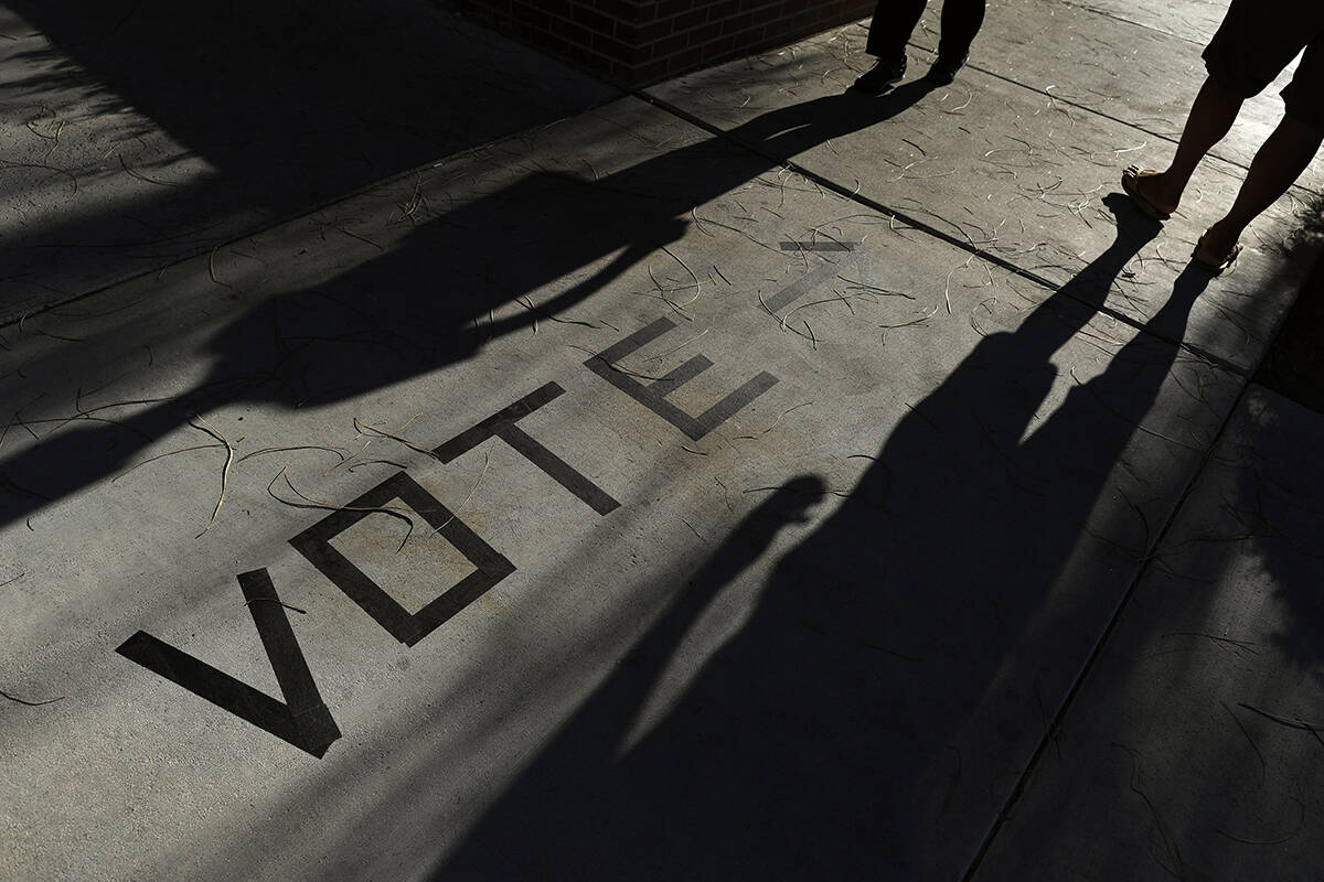 Voters head to the polls at the Enterprise Library in Las Vegas in 2018. (AP Photo/Joe Buglewicz)