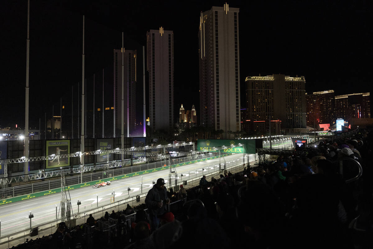 Ferrari driver Carlos Sainz rounds the circuit during qualifying for the Formula One Las Vegas ...
