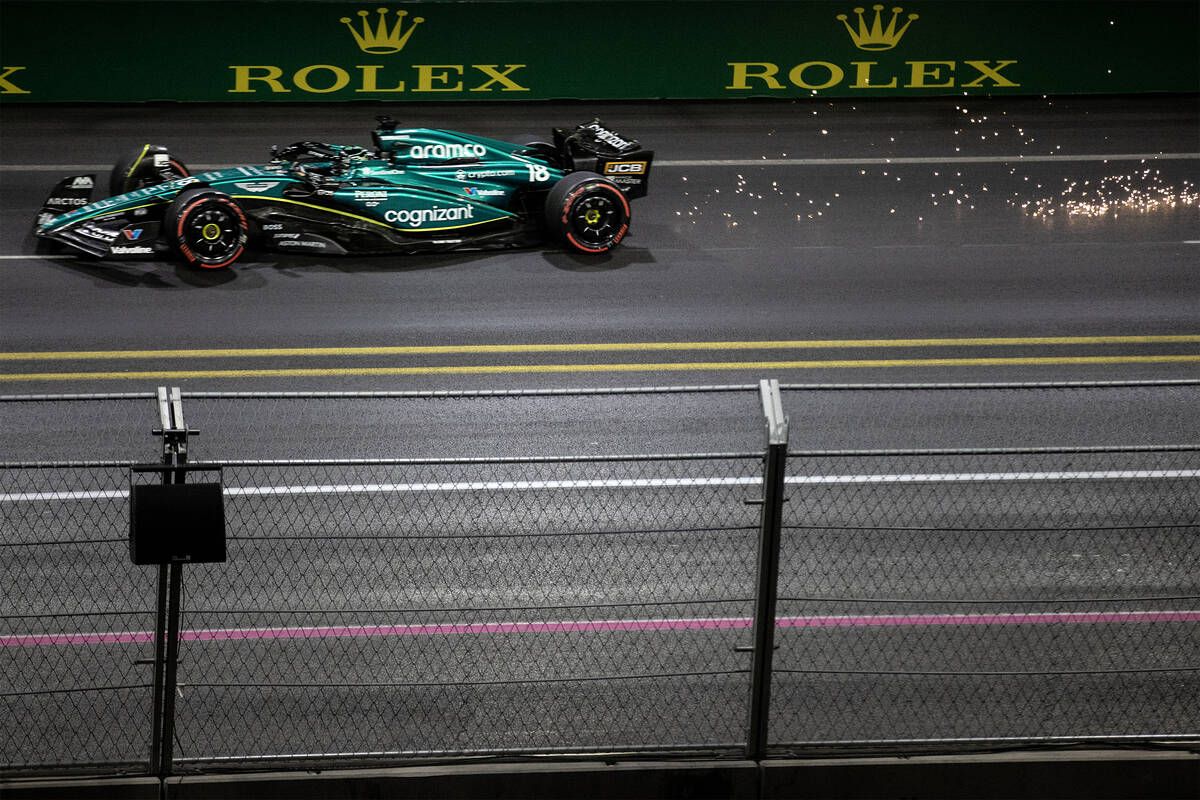 Aston Martin driver Lance Stroll kicks sparks up while rounding the circuit during qualifying f ...