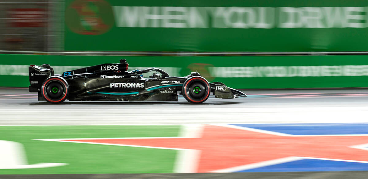 Mercedes driver George Russell rounds turn 1 during the qualifying session on the second night ...