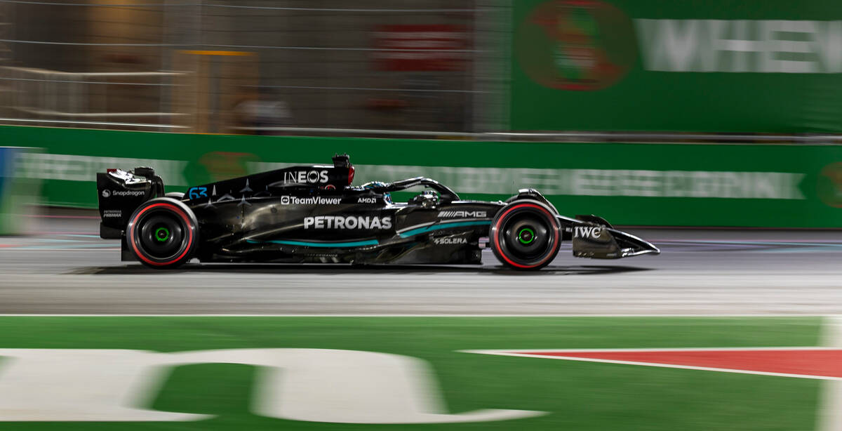 Mercedes driver George Russell rounds turn 1 during the qualifying session on the second night ...