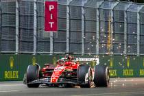 Ferrari driver Charles LeClerc kicks up sparks on the final stretch during the qualifying sessi ...