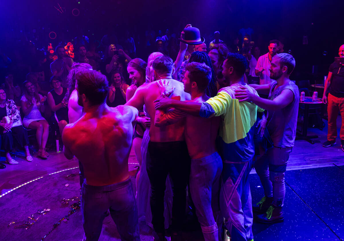 Cast members of “OPM” embrace after the final show of Grace Lusk and duo Emily En ...