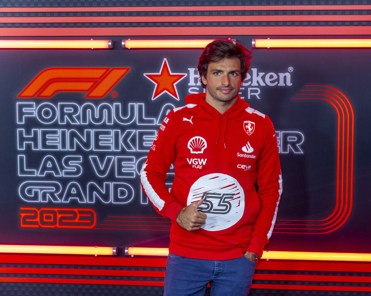 Ferrari driver Carlos Sainz momentarily stops on the "red carpet" during race night o ...