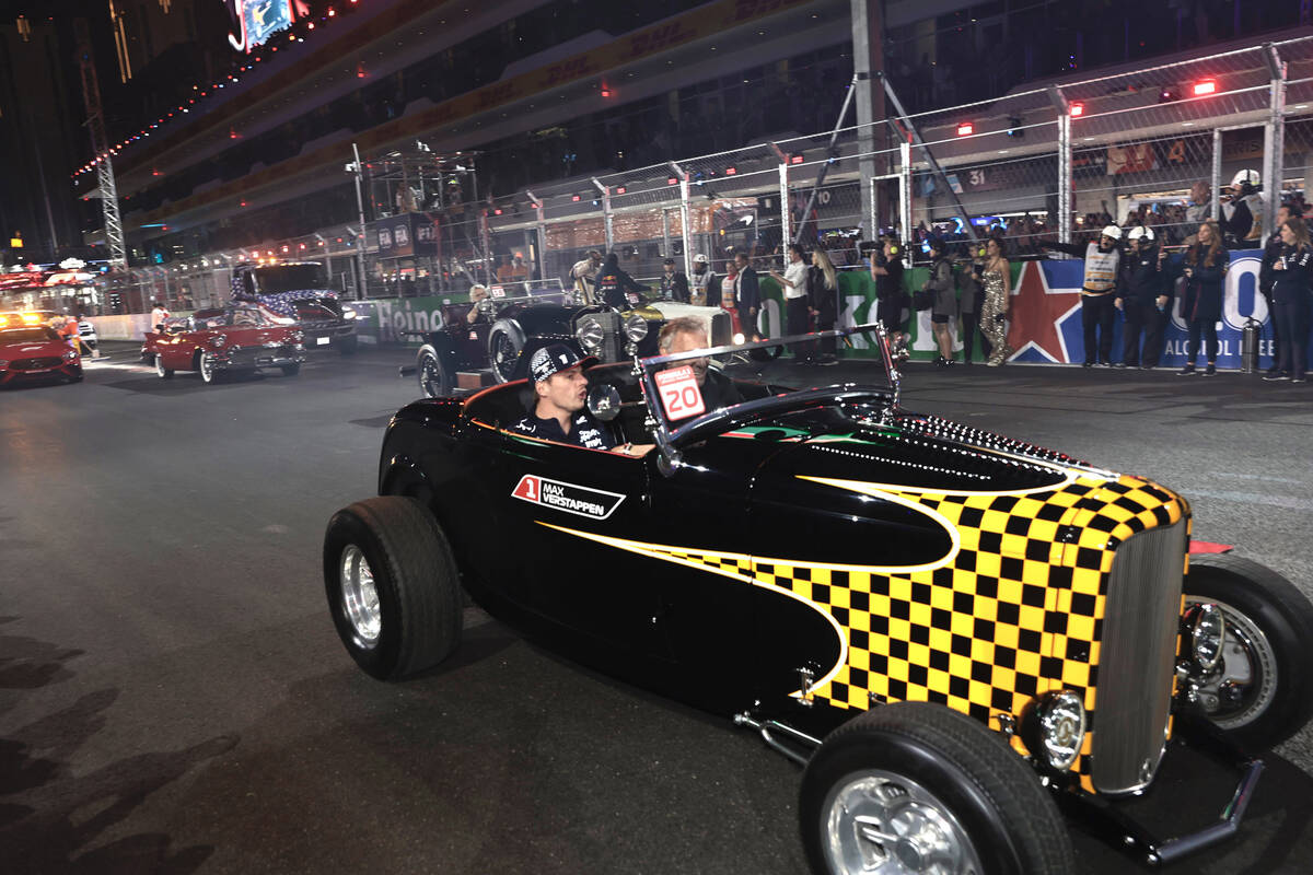 Red Bull driver and race favorite Max Verstappen rides in a classic car during the driver’s p ...