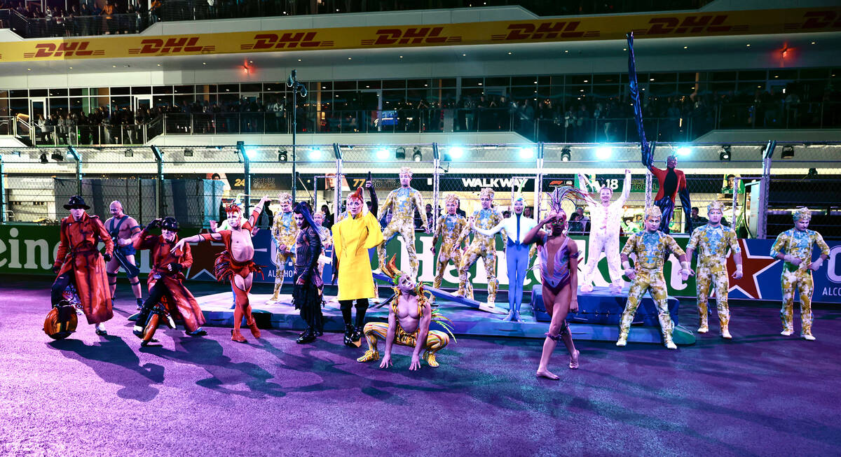 Cirque performers conclude a show for fans on the track before the start of the race at the Las ...