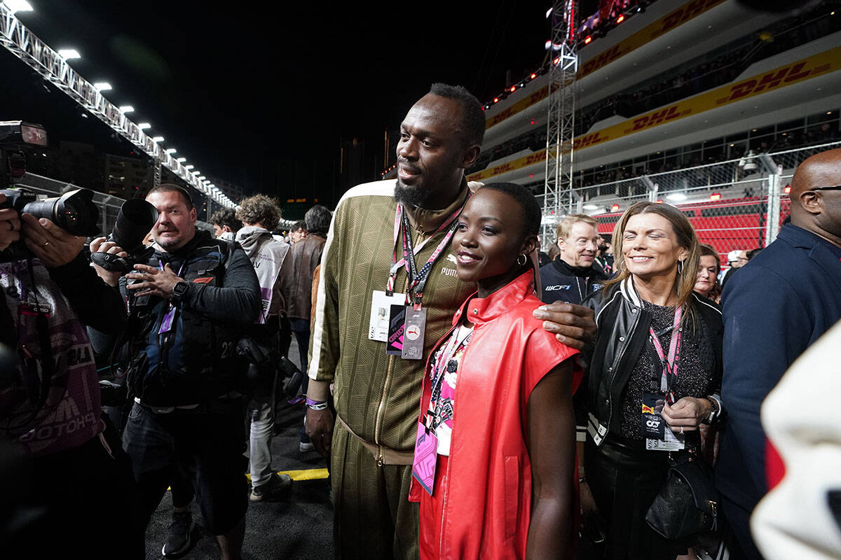 Usain Bolt poses for photos with actor Lupita Nyong'o at the Formula One Las Vegas Grand Prix a ...
