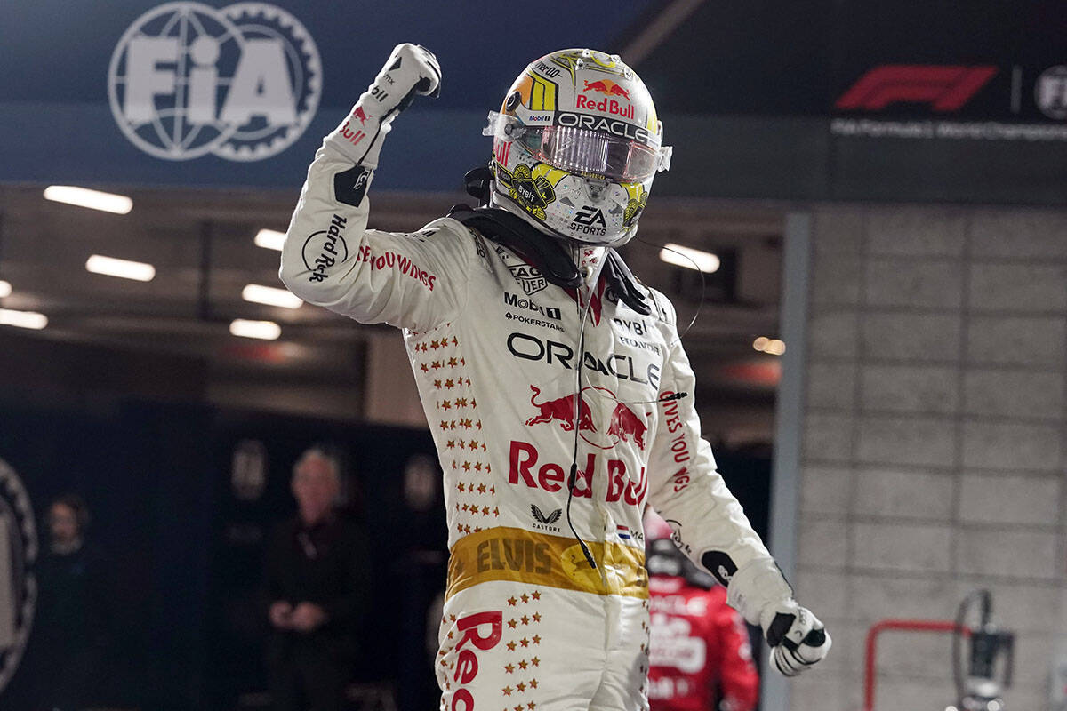 Red Bull driver Max Verstappen, of the Netherlands, celebrates after winning the Formula One La ...