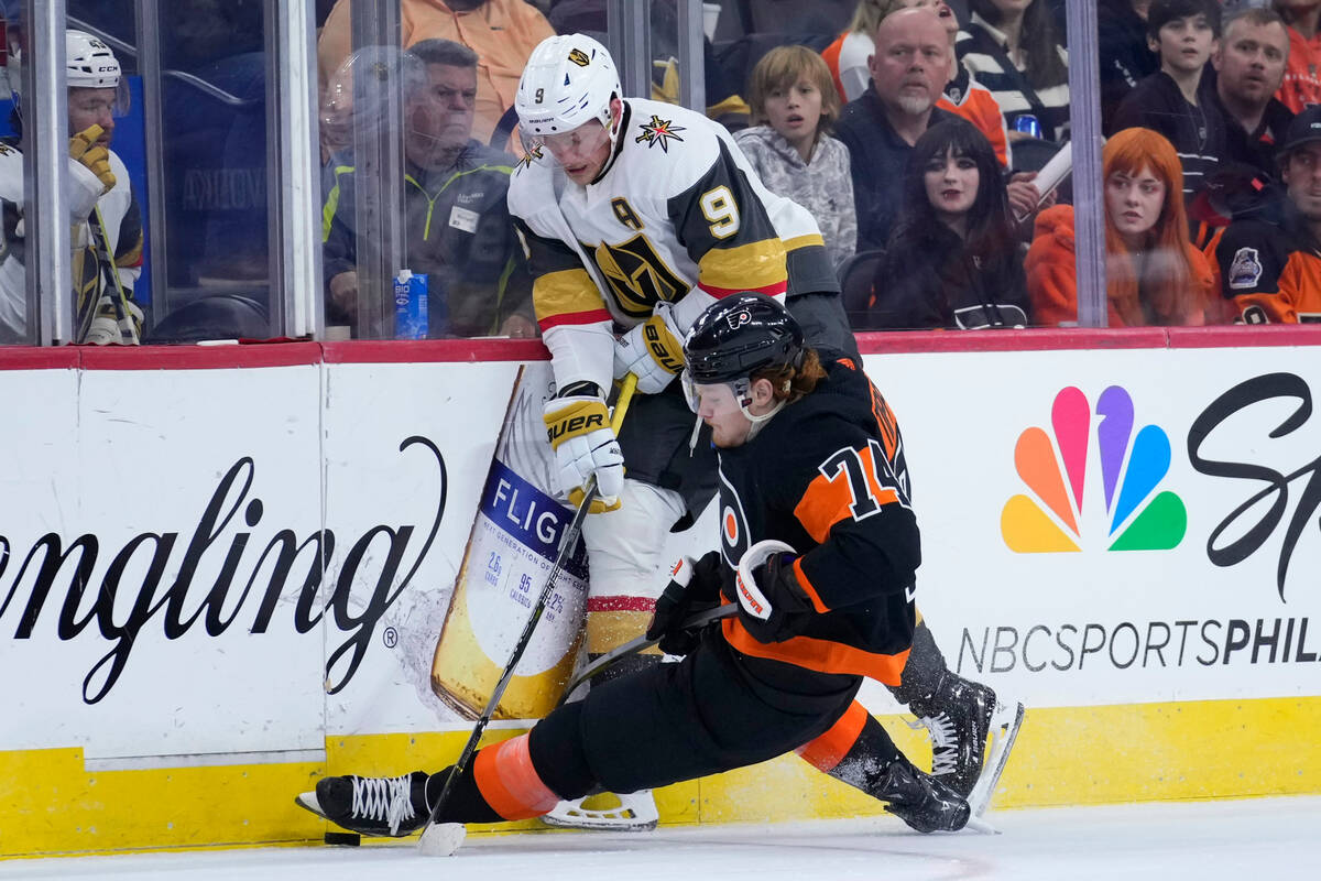 Philadelphia Flyers' Owen Tippett, bottom, and Vegas Golden Knights' Jack Eichel collide during ...