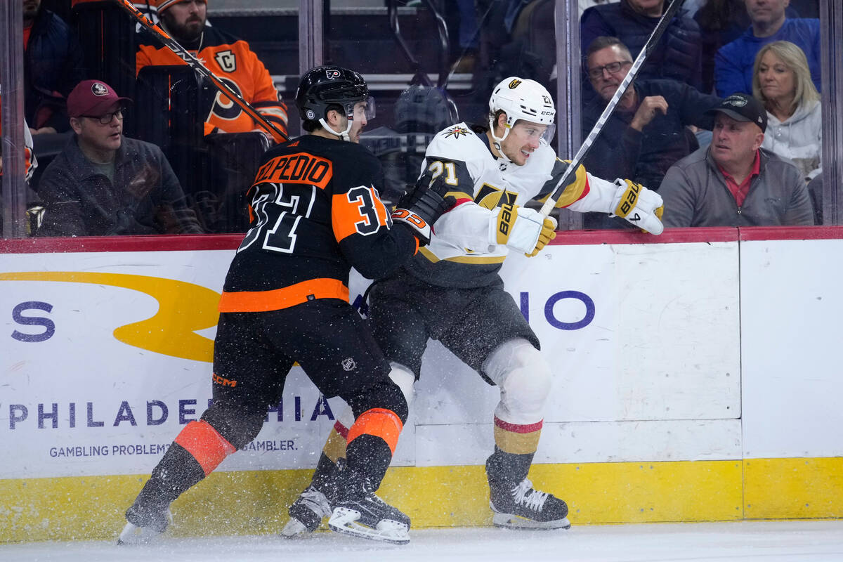 Philadelphia Flyers' Louie Belpedio, left, and Vegas Golden Knights' Brett Howden collide durin ...