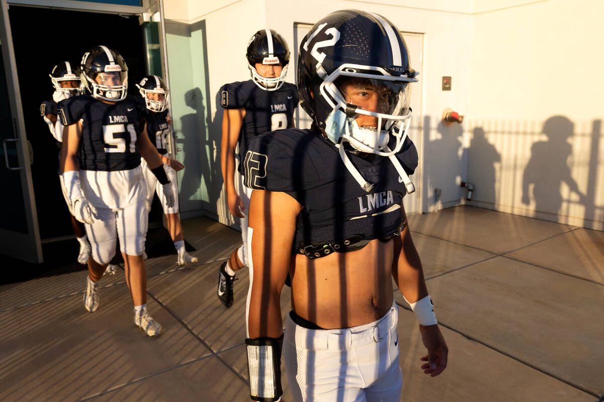 Lake Mead running back Luke Corpus (12) heads to the field for a Class 2A high school football ...