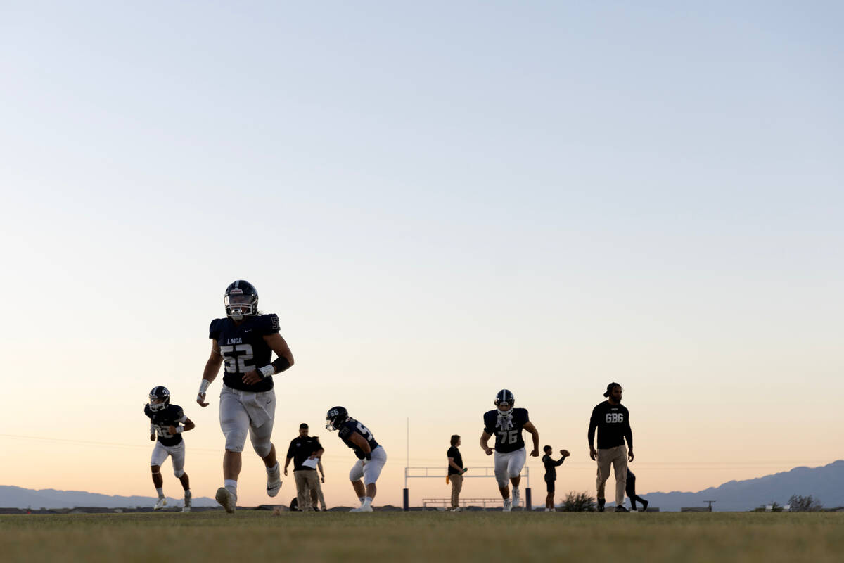 Lake Mead players warmup up before their Class 2A high school football game against Lincoln Cou ...