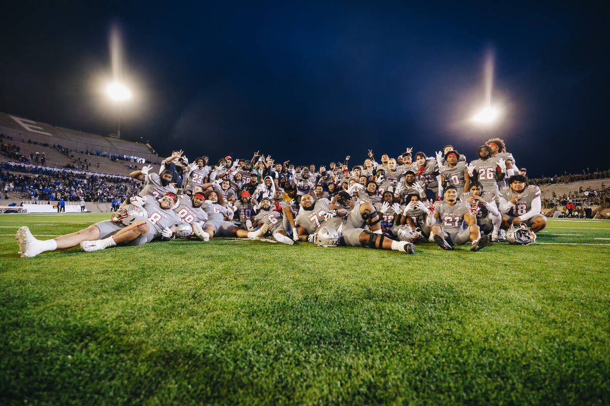 The UNLV football team poses for a photograph after beating Air Force at Falcon Stadium on Satu ...