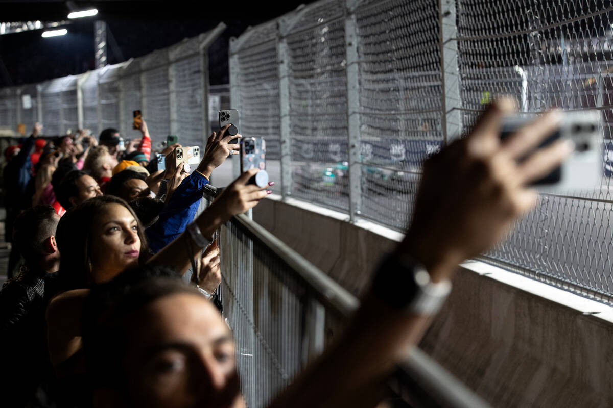 Fans record during the third practice for the Formula One Las Vegas Grand Prix auto race on Fri ...