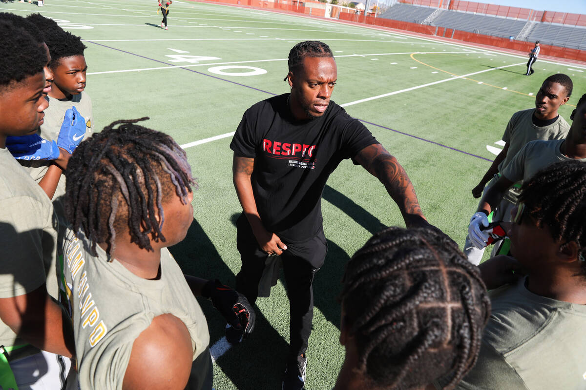 Retired NFL player Brandon Marshall coaches the high school team during the third annual Turkey ...