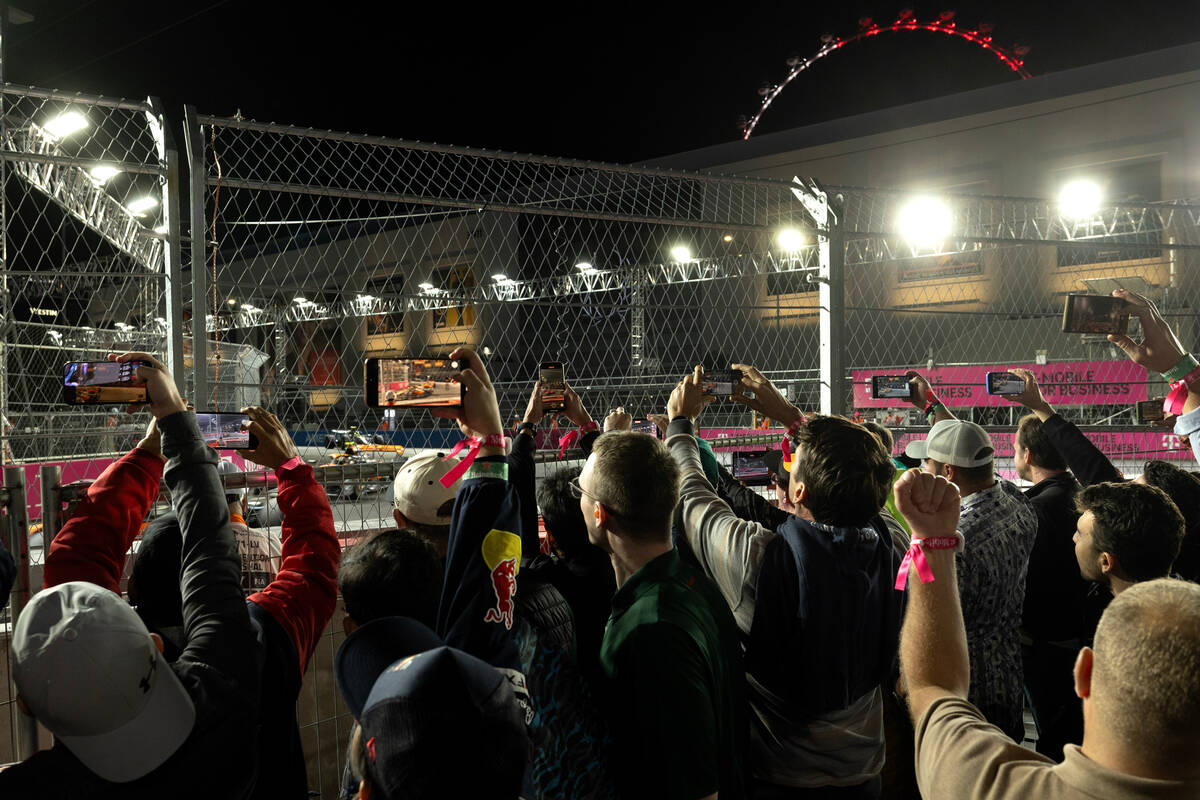 Fans crowd the fences to get a glimpse as drivers pass the Sphere during the Formula One Las Ve ...